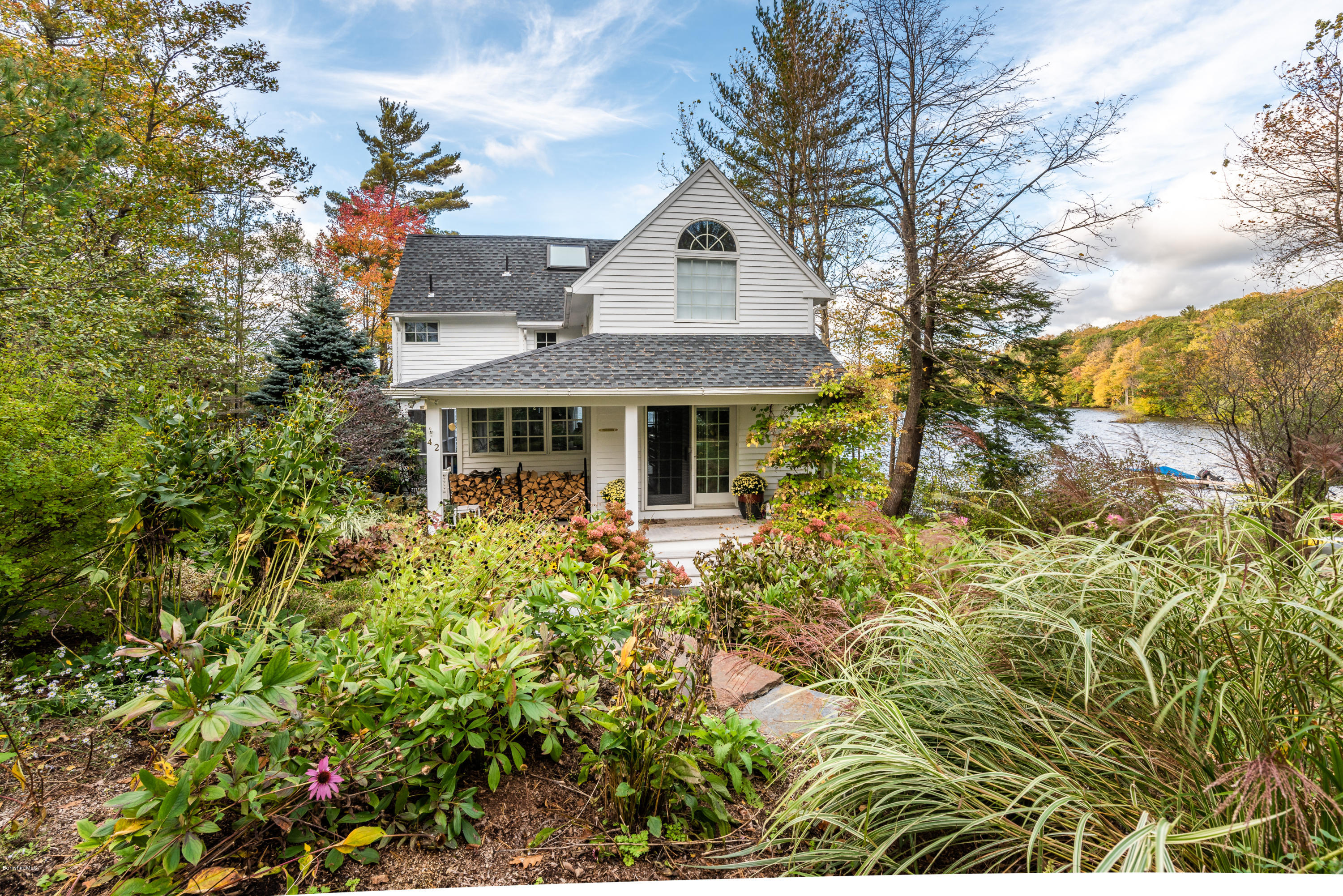 42 Lake Rd Extension Richmond, MA 01201 - Photo 7 of 40 a front view of a house with a garden