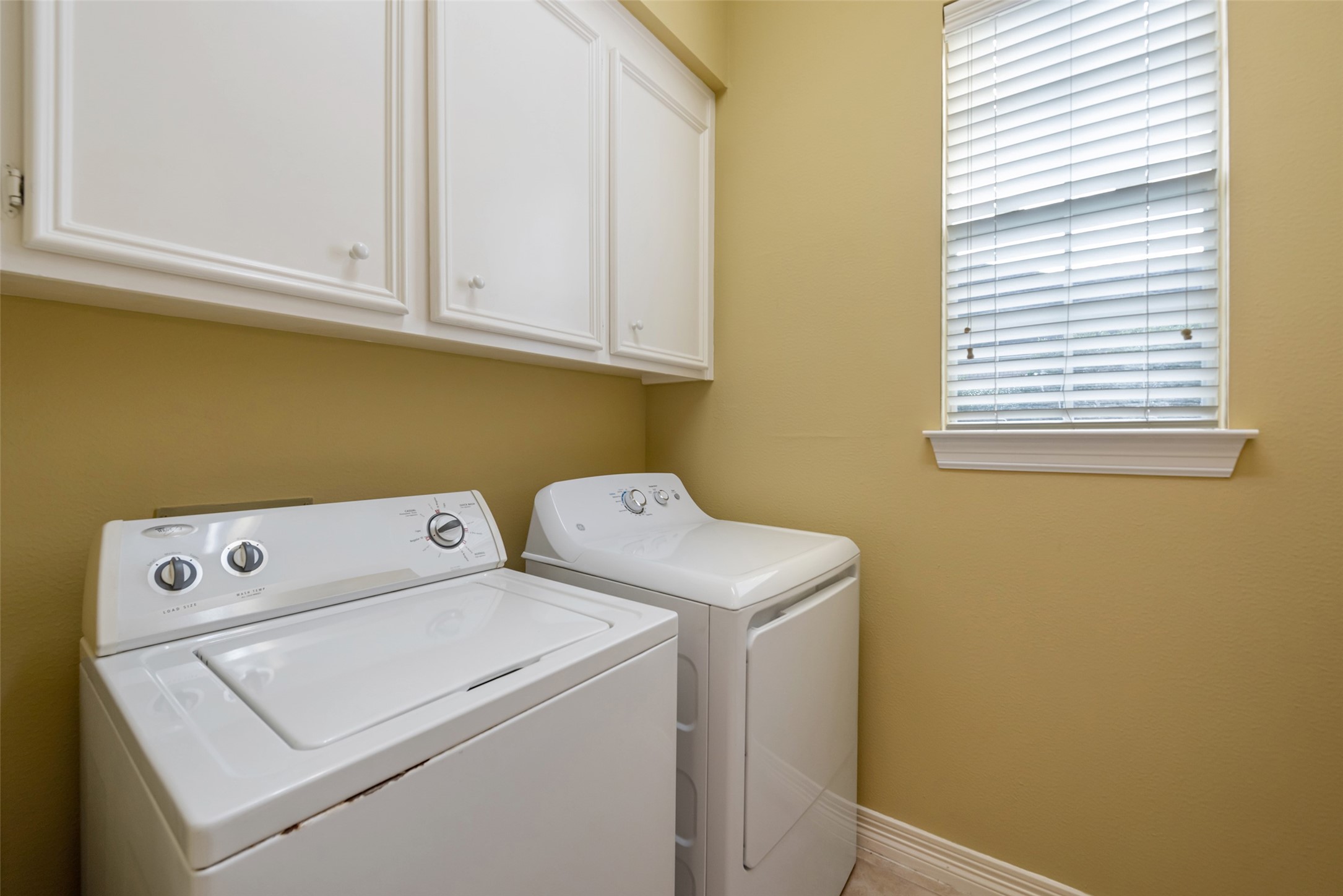 15306 Beecham Drive Houston, TX 77068 - Photo 21 of 48 Utility room is tucked off the kitchen area. Washer and dryer stay with the house.