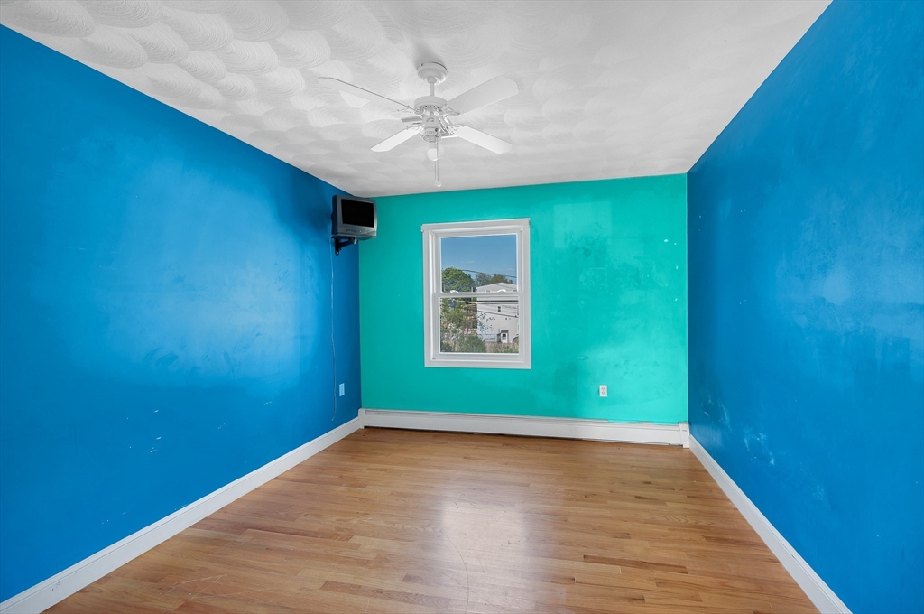 7 Marie Street Methuen, MA 01844 - Photo 30 of 39 a view of empty room with wooden floor and fan