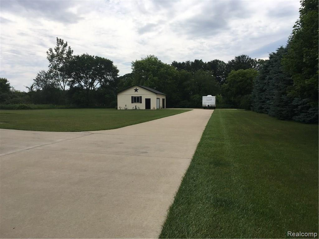 10085 North Webster Road Clio, MI 48420 - Photo 25 of 40 Long Cement Driveway to Pole Barn in Back!