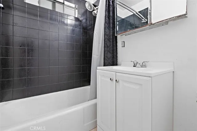 a bathroom with a sink a toilet and bathtub