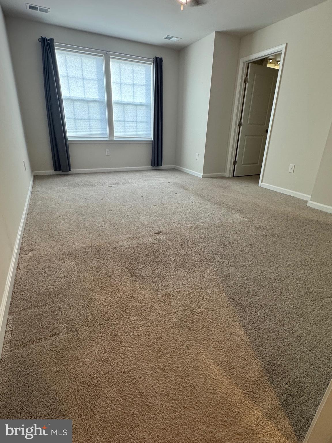 61 Arlotta Street Glassboro, NJ 08028 - Photo 4 of 13 a view of an empty room with a window