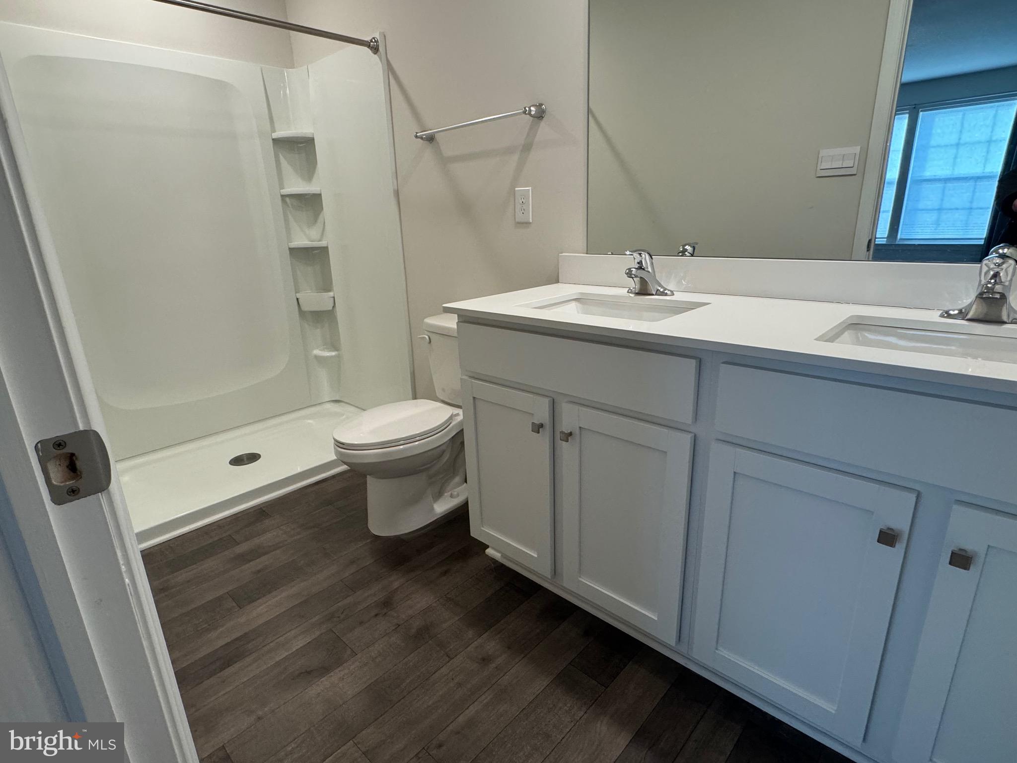 61 Arlotta Street Glassboro, NJ 08028 - Photo 5 of 13 a bathroom with a sink toilet and shower