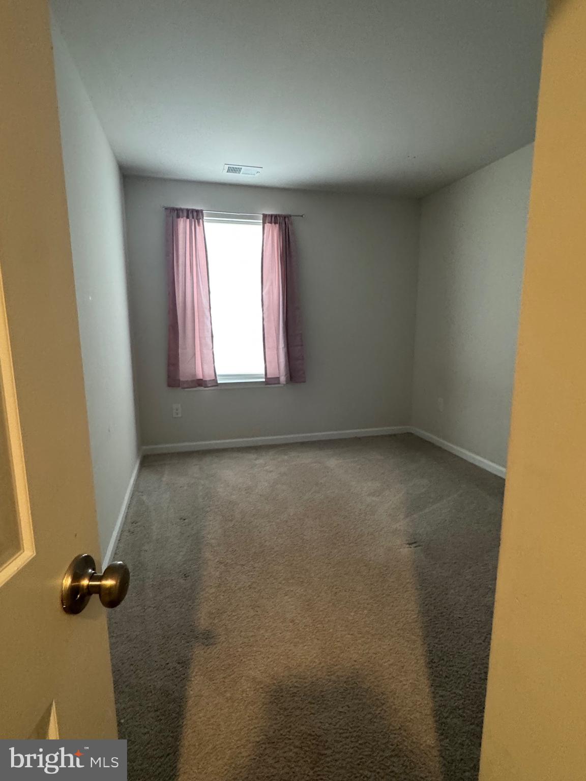 61 Arlotta Street Glassboro, NJ 08028 - Photo 8 of 13 an empty room with a window