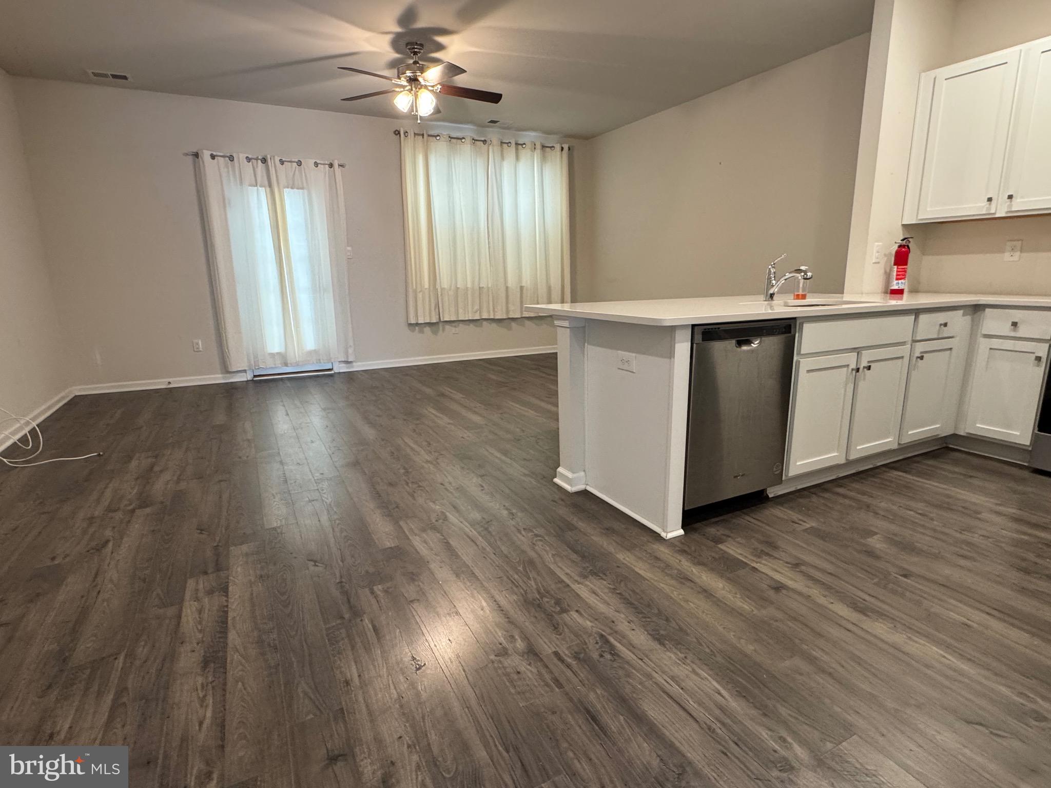 61 Arlotta Street Glassboro, NJ 08028 - Photo 10 of 13 a view of a kitchen with wooden floor and window
