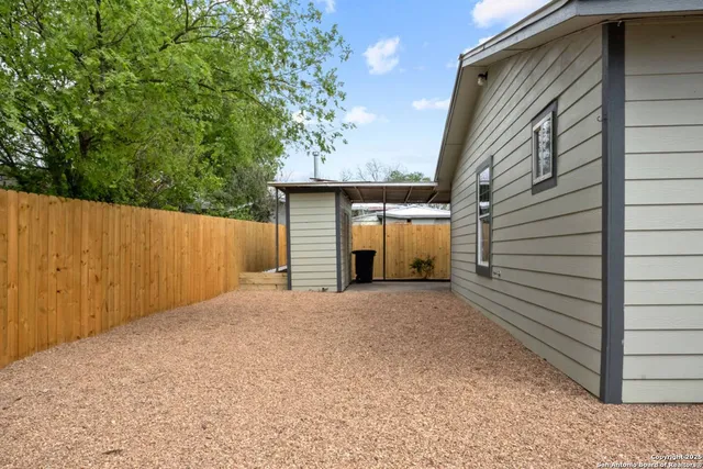 a view of backyard and entertaining space