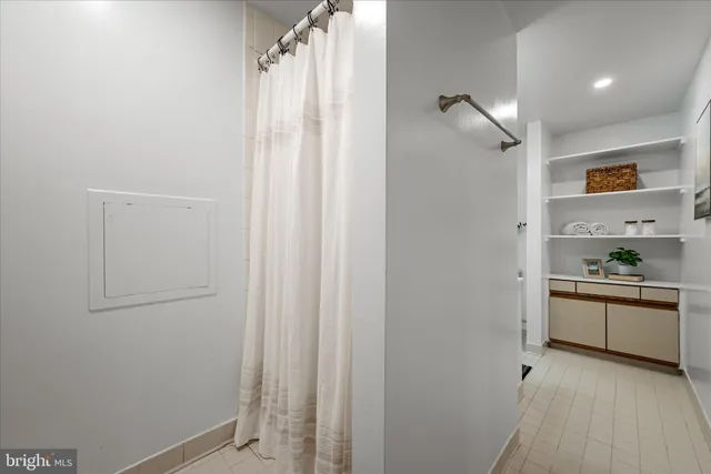 a kitchen with cabinets and window