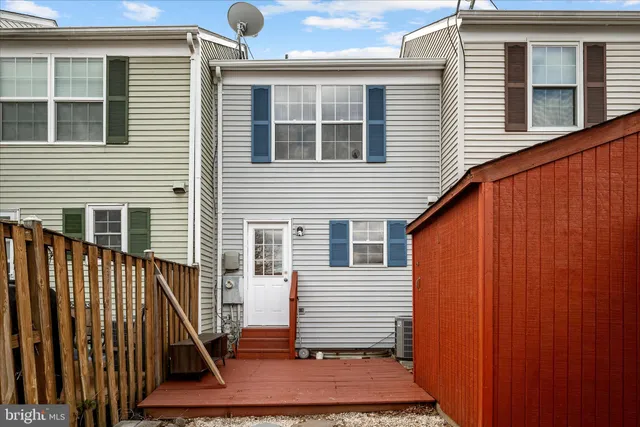 a view of a house with wooden floor and a window