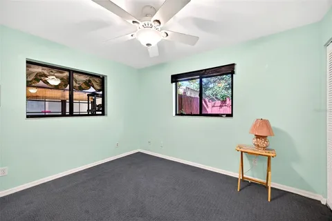 a room with window and a ceiling fan