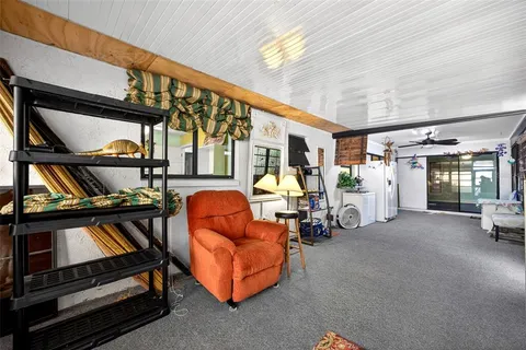a view of living room with furniture and entryway