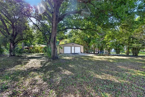 a backyard of a house with lots of green space