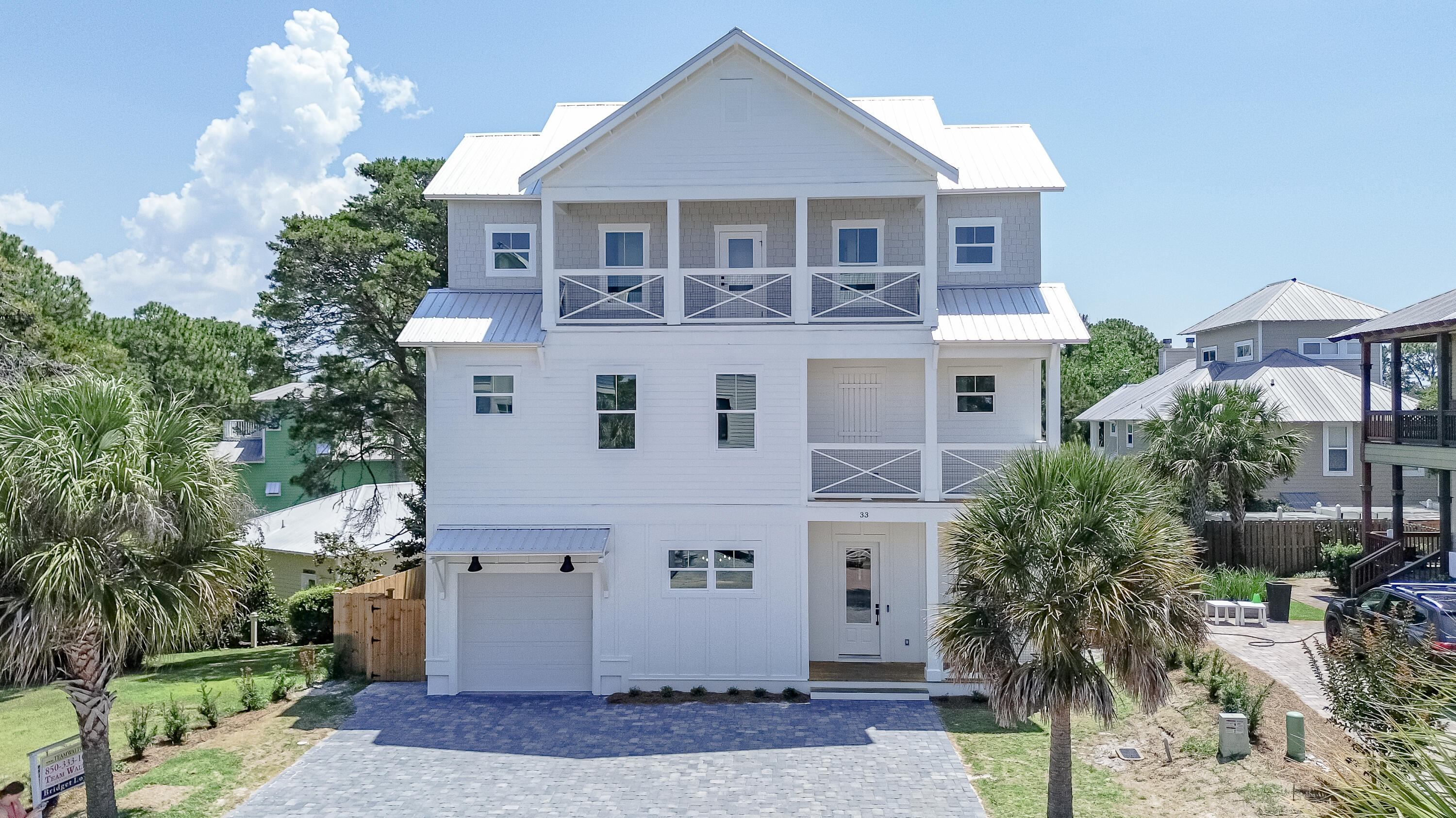 33 Maritime Way Santa Rosa Beach, FL 32459 - Photo 1 of 71 a front view of a house with a yard and garage