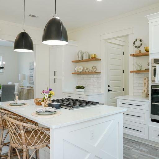 33 Maritime Way Santa Rosa Beach, FL 32459 - Photo 21 of 71 a kitchen with a stove and a wooden floor