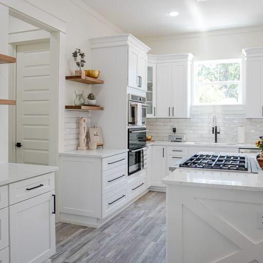 33 Maritime Way Santa Rosa Beach, FL 32459 - Photo 23 of 71 a kitchen with white cabinets and appliances