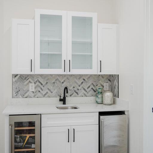 33 Maritime Way Santa Rosa Beach, FL 32459 - Photo 44 of 71 a view of cabinets a sink and a potted plant on a dresser