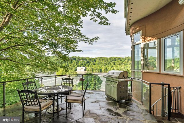 a view of a patio with table and chairs