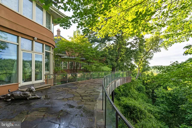 a view of a chair and tables in the balcony