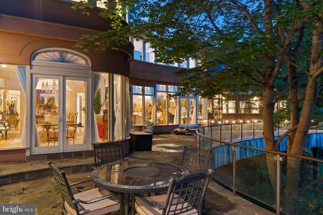 a view of swimming pool with outdoor seating