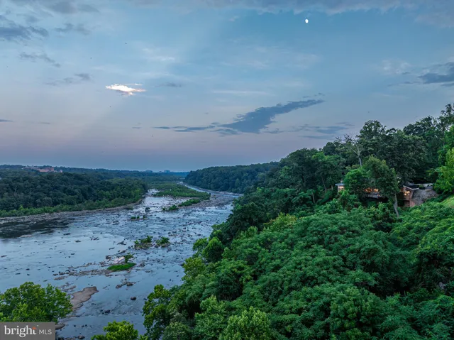a view of a lake with a yard