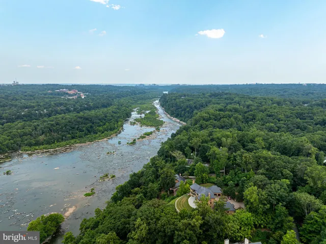 an aerial view of house with yard