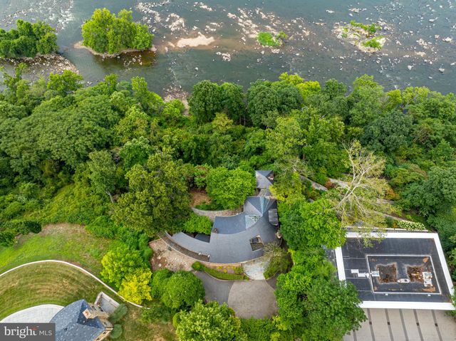 a view of a house with a yard covered in snow
