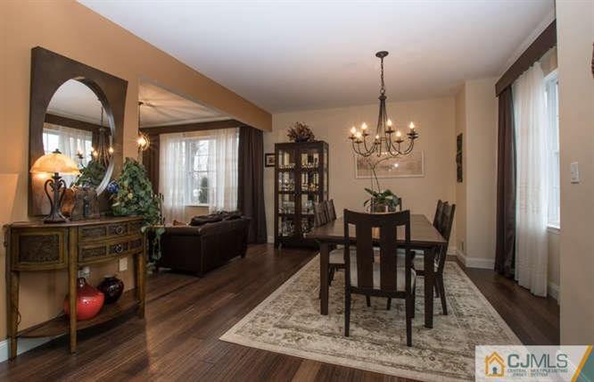 52 Lexington Road Monmouth Junction, NJ 08852 - Photo 4 of 15 a view of a dining room with furniture and wooden floor
