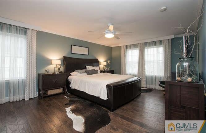 52 Lexington Road Monmouth Junction, NJ 08852 - Photo 7 of 15 a spacious bedroom with a bed and wooden floor