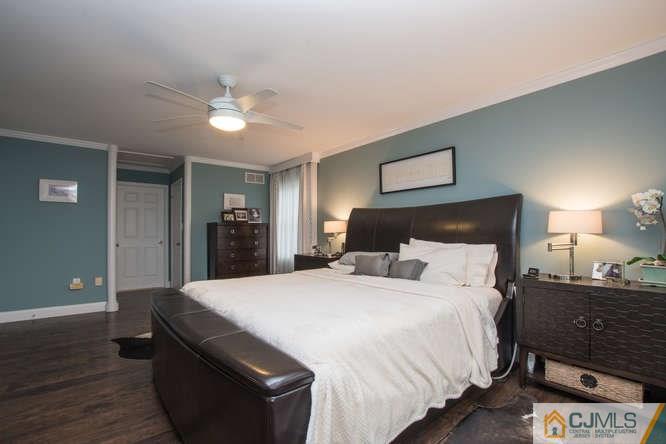 52 Lexington Road Monmouth Junction, NJ 08852 - Photo 8 of 15 a bedroom with a bed and a lamp
