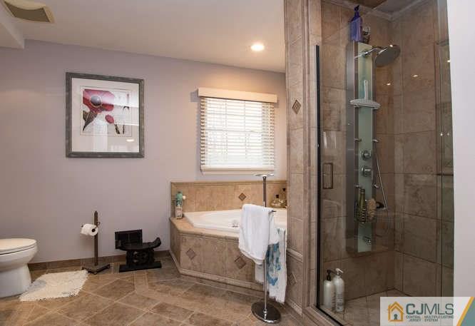 52 Lexington Road Monmouth Junction, NJ 08852 - Photo 9 of 15 a bathroom with a toilet and a shower