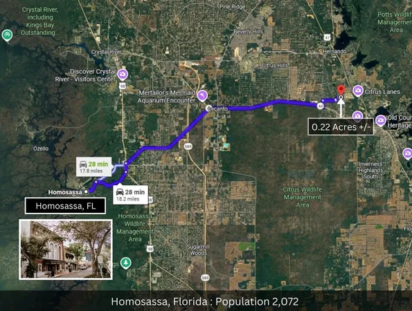 a street sign on a wall next to a road