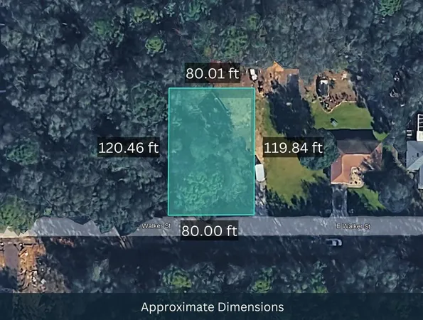 a sign that is sitting on a brick wall