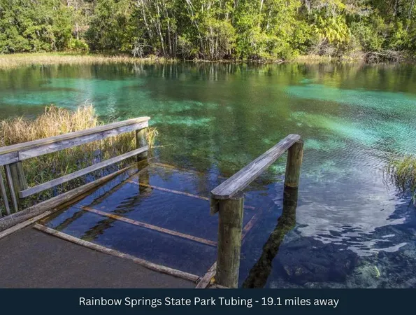 a view of a wooden deck with lake view