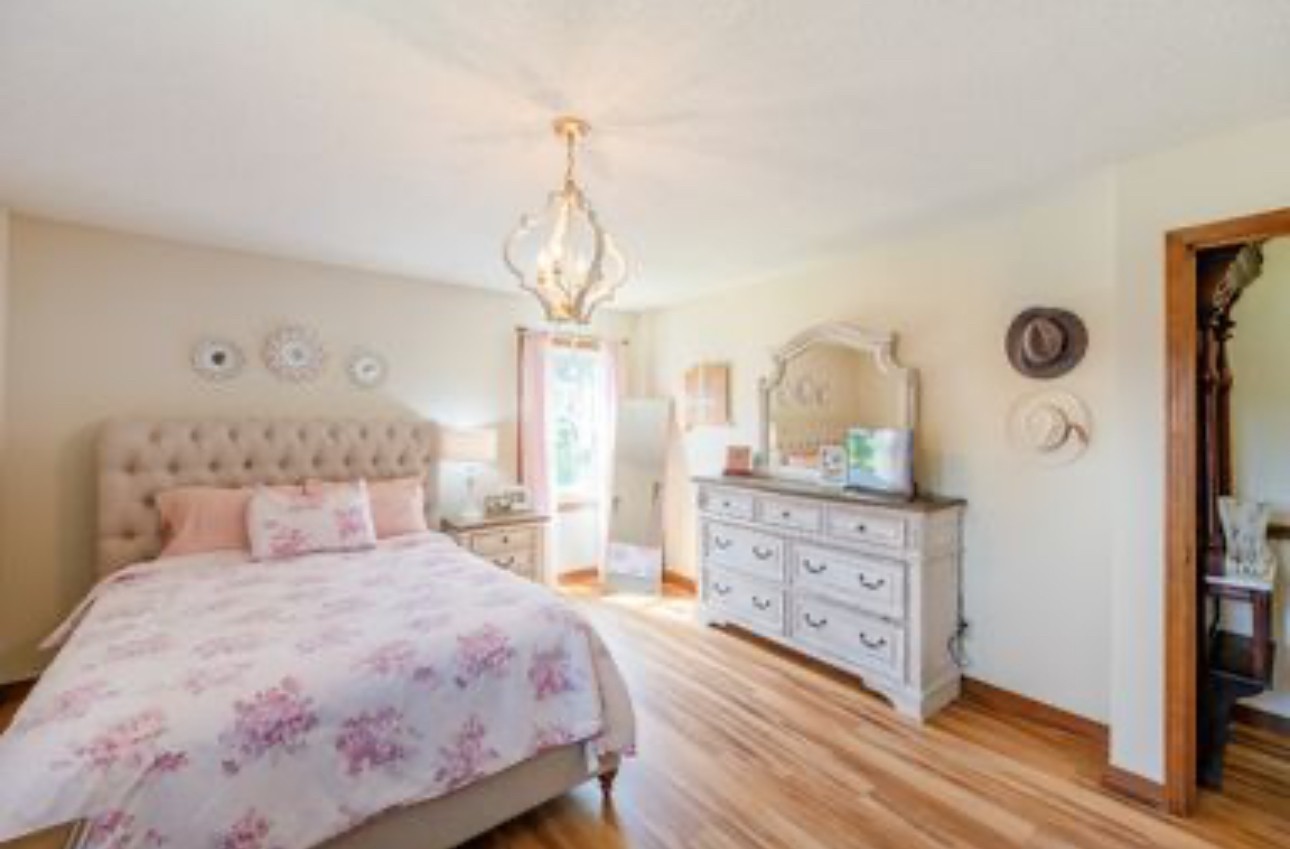 533 Taylor Street Bruceton, TN 38317 - Photo 16 of 22 a bedroom with a bed and a dresser