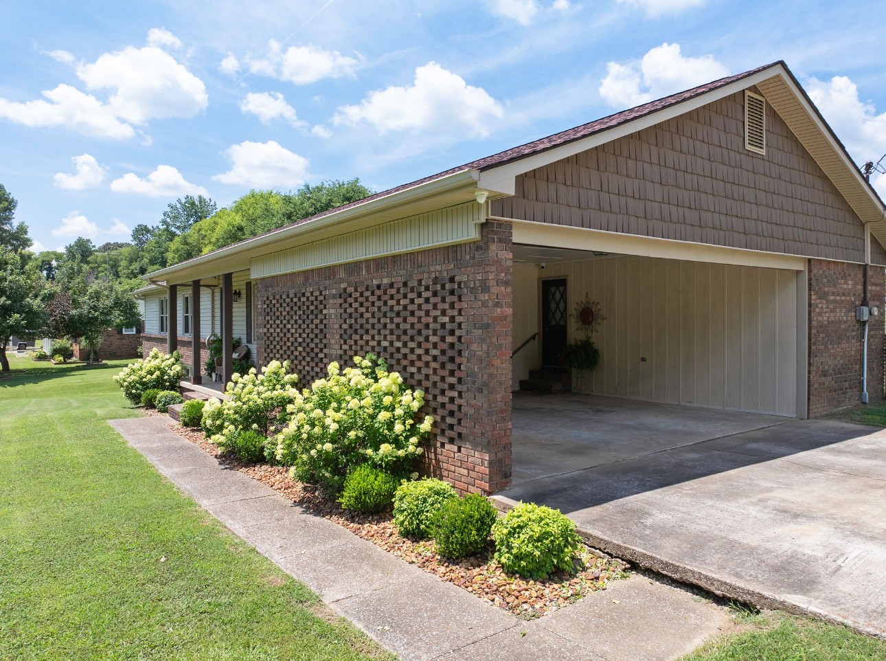 533 Taylor Street Bruceton, TN 38317 - Photo 4 of 22 a front view of a house with garden