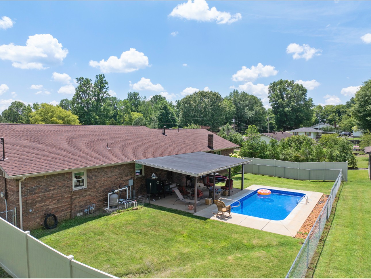 533 Taylor Street Bruceton, TN 38317 - Photo 6 of 22 an aerial view of residential houses with yard and swimming pool