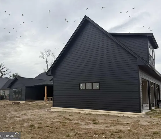 front view of a house with a large window