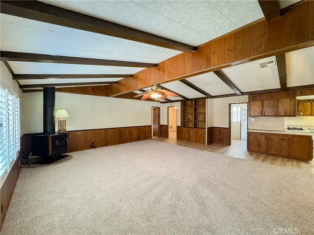 a view of an empty room with a fireplace