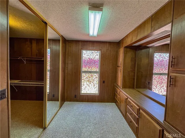 a front view of a house with parking space