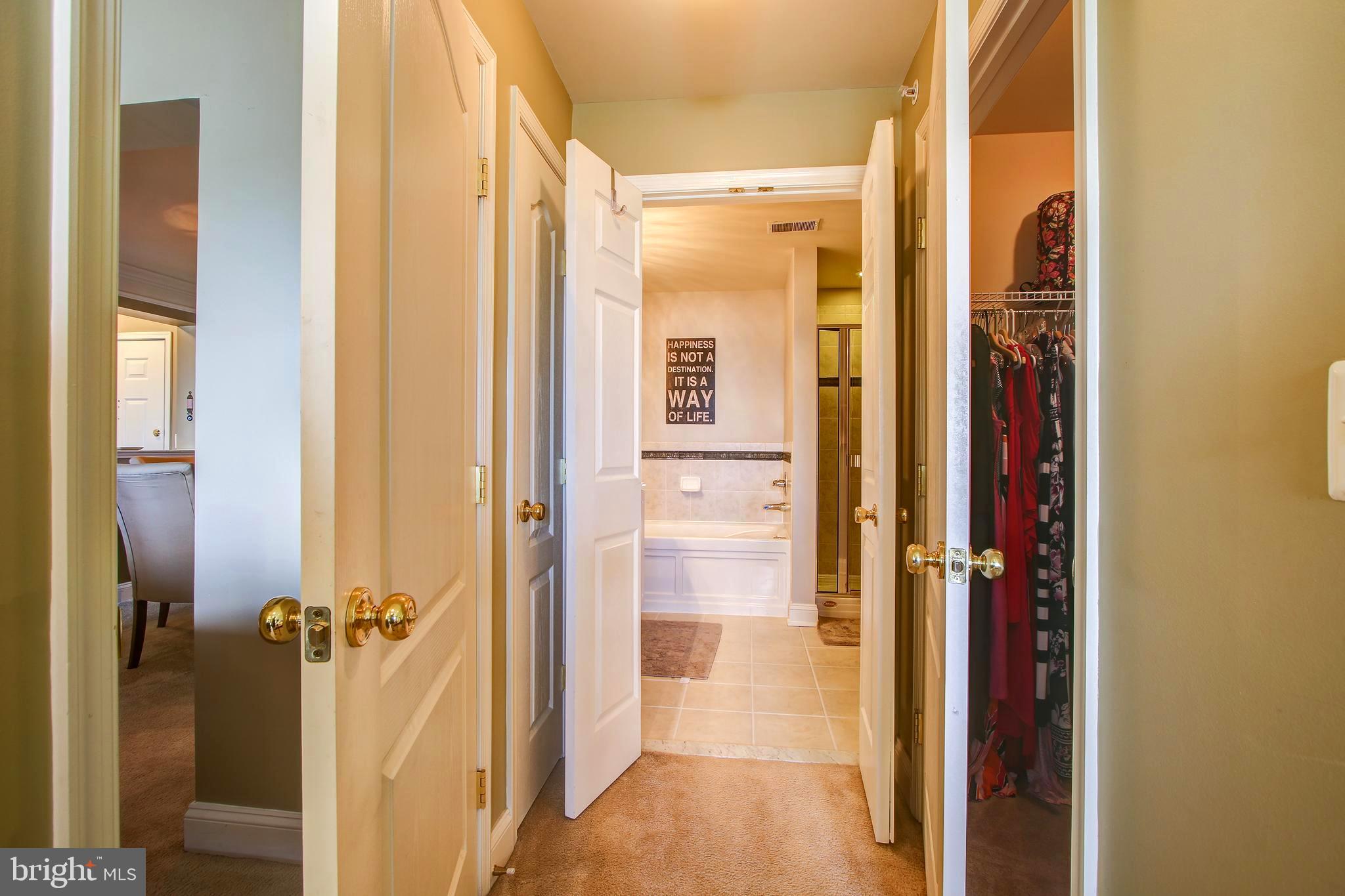 12824 Clarksburg Square Road, Unit 405 Clarksburg, MD 20871 - Photo 21 of 32 Walk in closet and en-suite bath in Master Bedroom