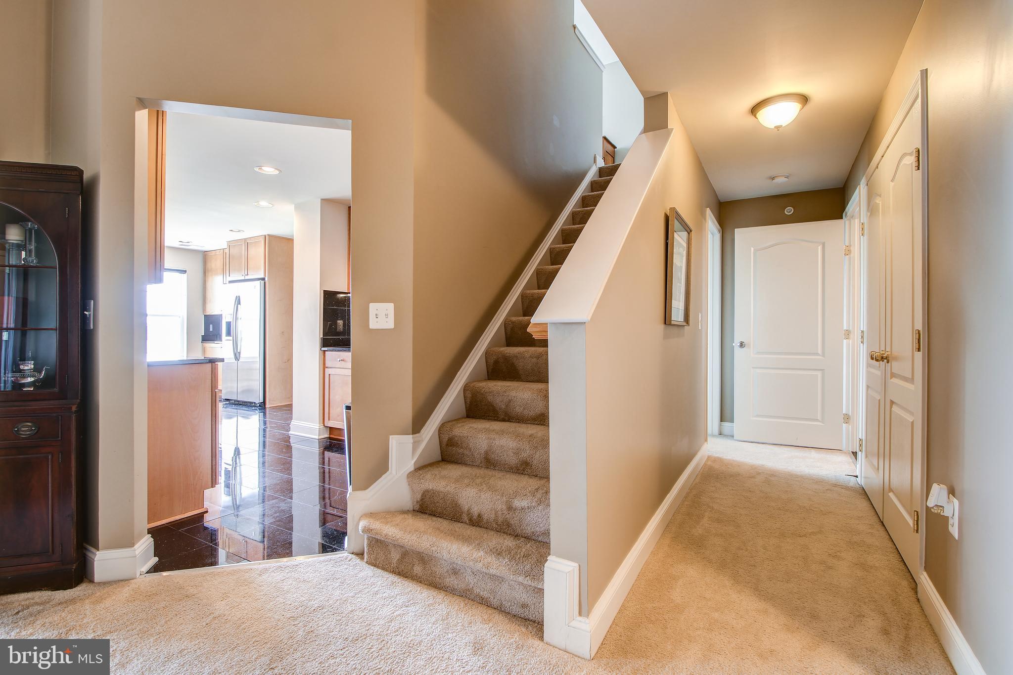 12824 Clarksburg Square Road, Unit 405 Clarksburg, MD 20871 - Photo 26 of 32 Stairway leading to the loft.