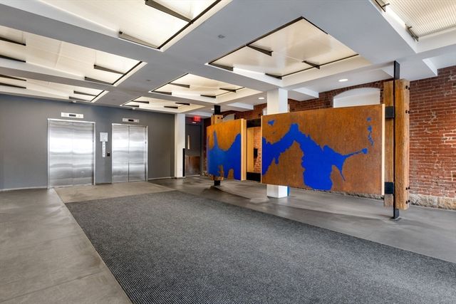 an entryway with ceiling fan