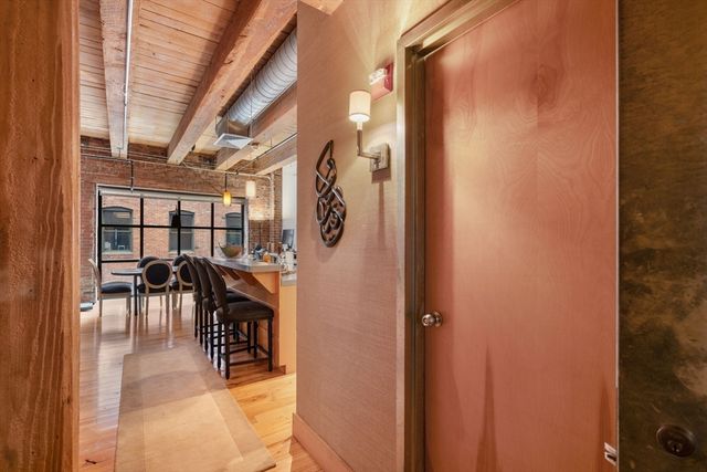 a view of a livingroom and a dining room with furniture