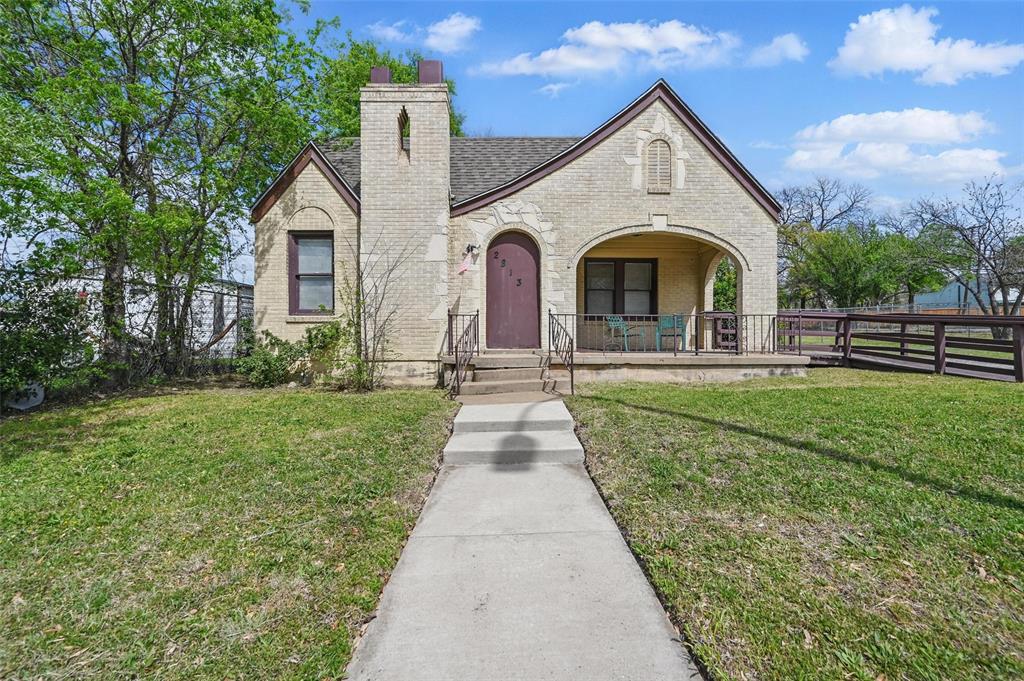 2813 East Rosedale Street Fort Worth, TX 76105 - Photo 1 of 23 a front view of a house with garden
