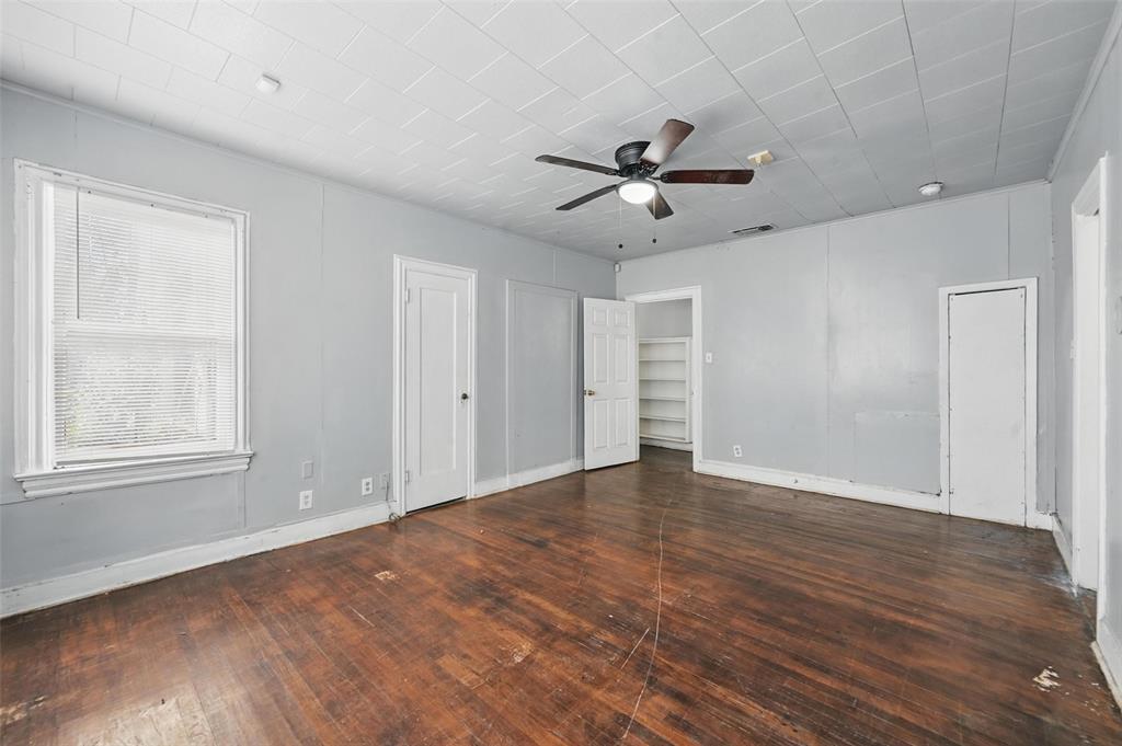 2813 East Rosedale Street Fort Worth, TX 76105 - Photo 12 of 23 a view of empty room with wooden floor and fan