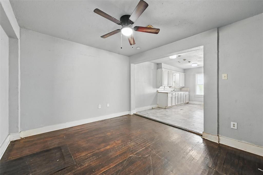 2813 East Rosedale Street Fort Worth, TX 76105 - Photo 15 of 23 a view of a room with a chandelier and wooden floor