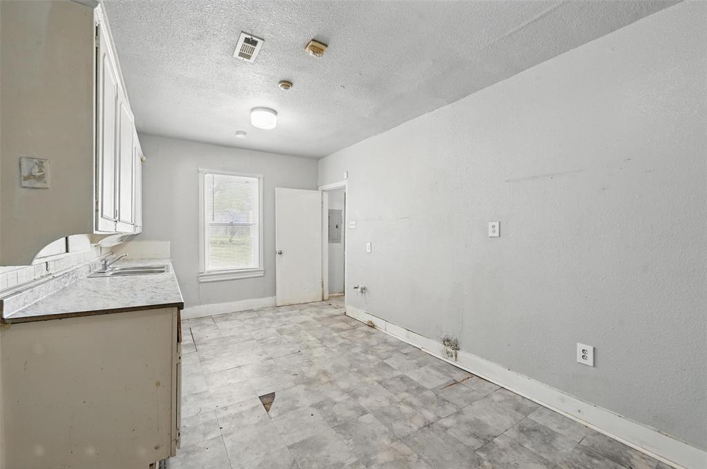 2813 East Rosedale Street Fort Worth, TX 76105 - Photo 18 of 23 a view of a kitchen with a sink and a window