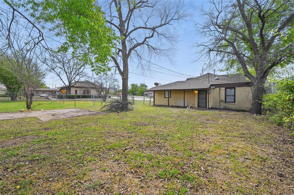 2813 East Rosedale Street Fort Worth, TX 76105 - Photo 21 of 23 a view of a house with a yard and tree