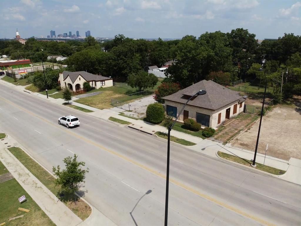 2813 East Rosedale Street Fort Worth, TX 76105 - Photo 3 of 23 an aerial view of a house with a garden and mountain view