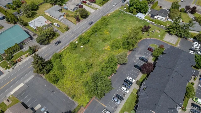 an aerial view of a residential houses with outdoor space