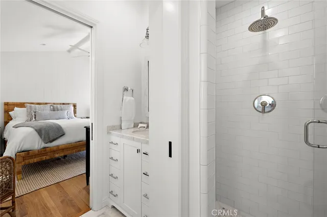 a bedroom with a bed and a mirror